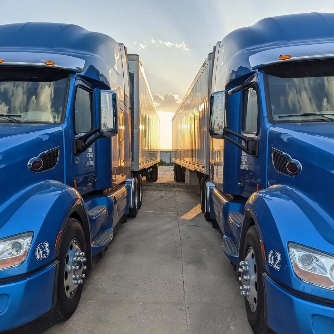 Two sure sound and lighting semi trucks